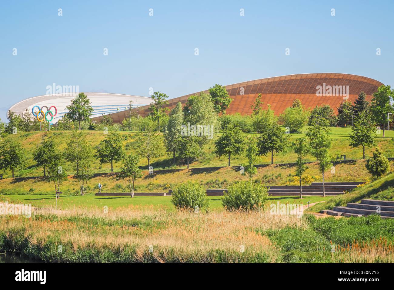 London Olympic rings and Lee Valley VeloPark on Queen Elizabeth Olympic Park in London, UK Stock Photo