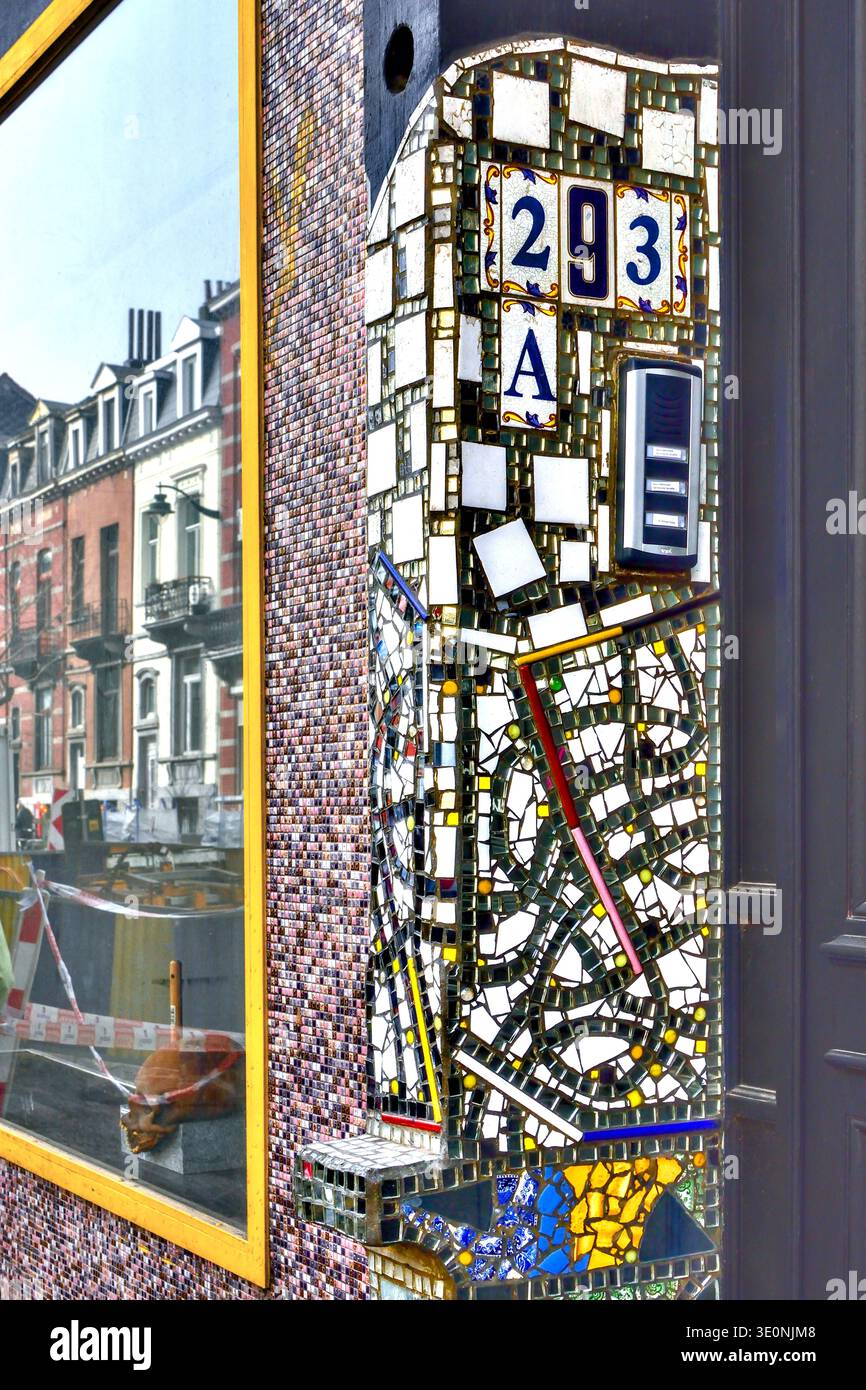 Unique house number and intercom housing hand-made from hundreds of  pieces of broken ceramic tiles - Saint-Gilles, B-ussels, Belgium. Stock Photo