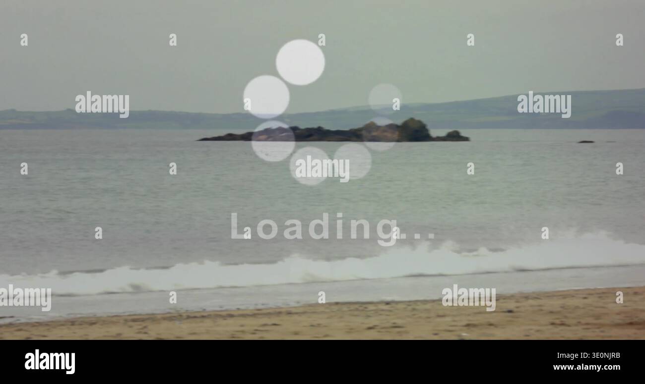 Calm Loading Showing centered rocky islet and calm sea surface at shoreline ...