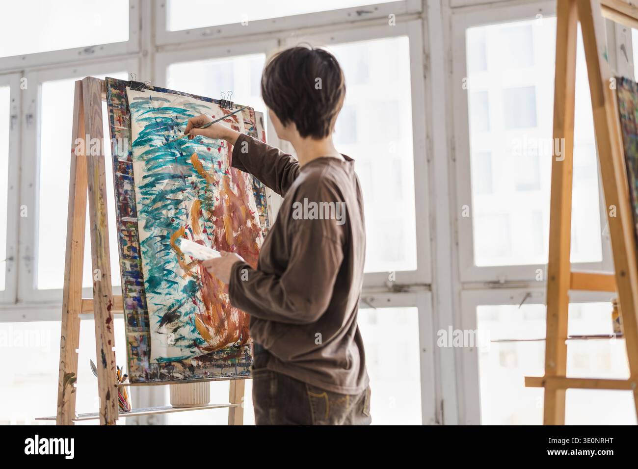 Female artist painting in her studio Stock Photo - Alamy