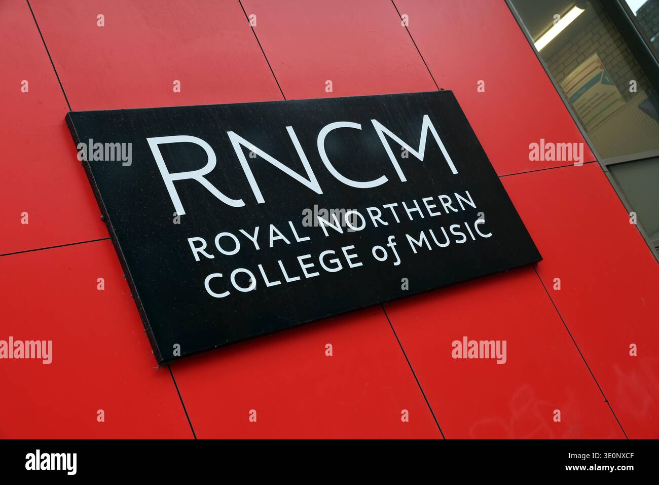 RNCM Royal Northern College of Music sign on the red exterior of the conservatoire building on Oxford Road, Manchester, England, UK. Stock Photo