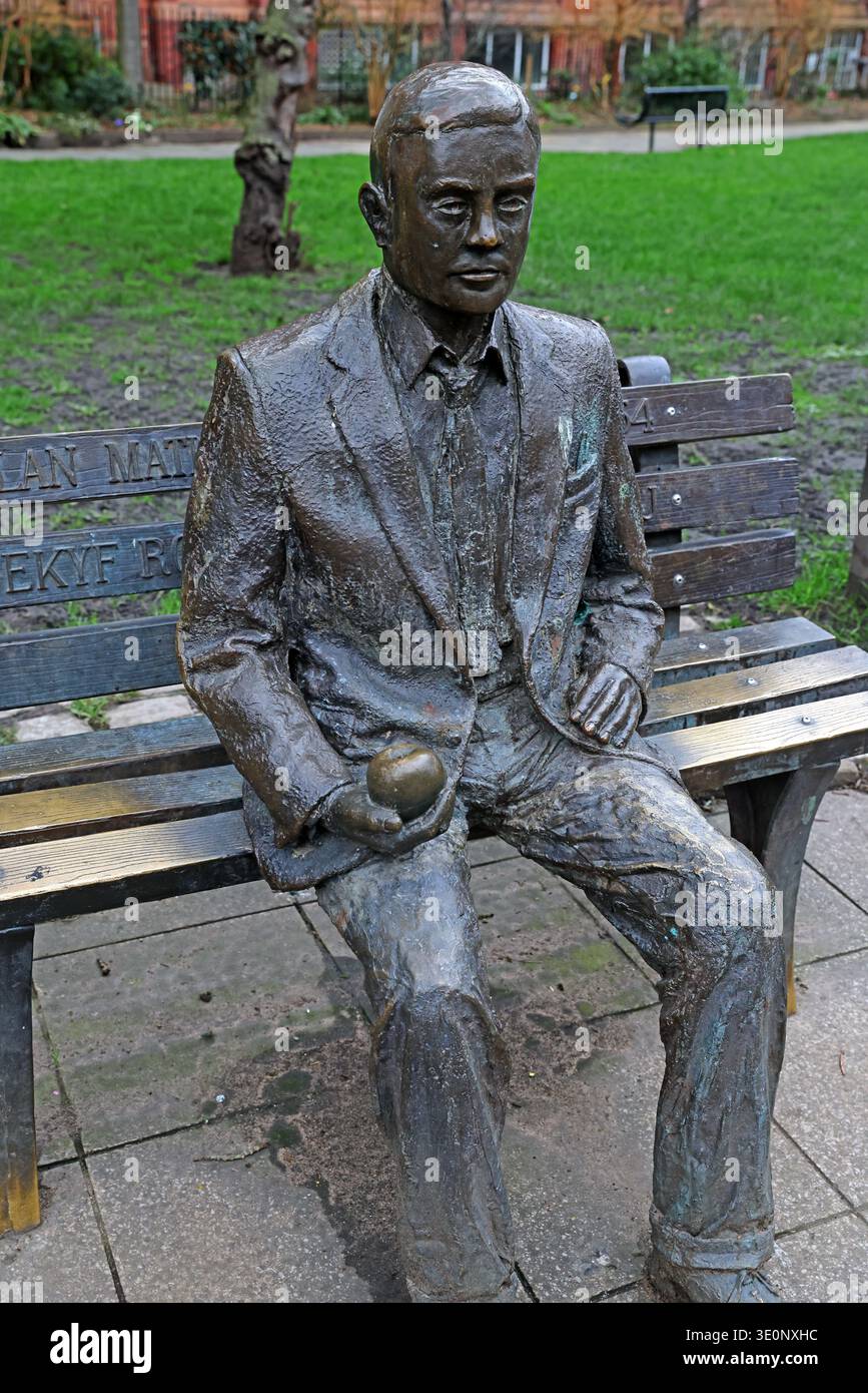 Side view of the Alan Turing memorial statue holding an apple in Sackville Gardens near Canal Street and Manchester Gay Village, Manchester, England, Stock Photo