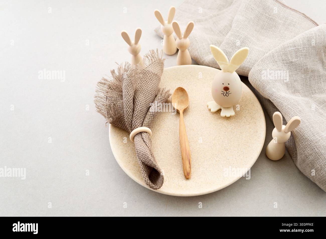 Zero waste Easter. Easter table setting with rustic bunny decorations Stock Photo