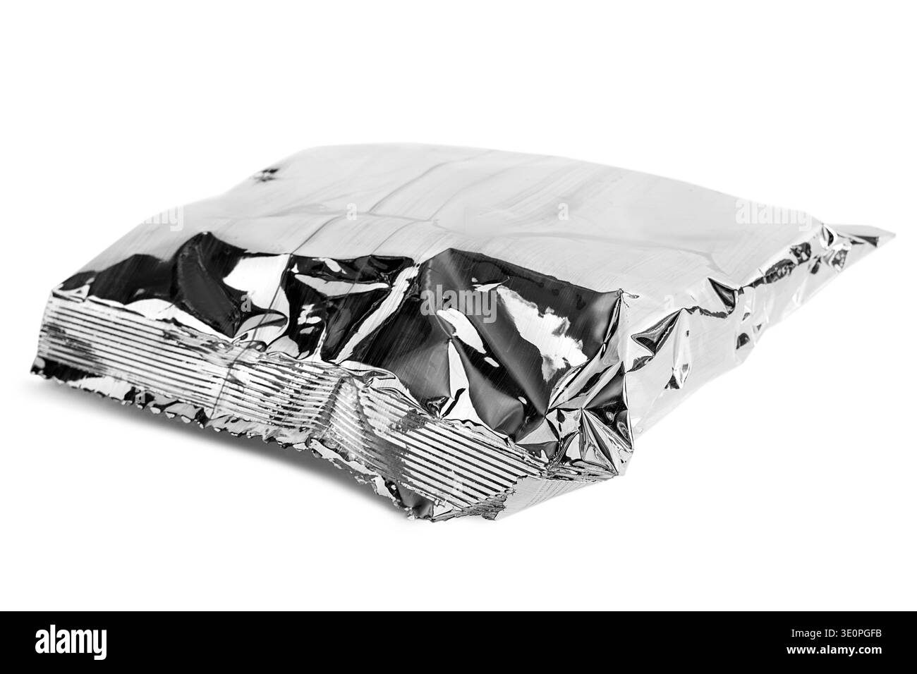 Silver foil paper packet lying on white background Stock Photo