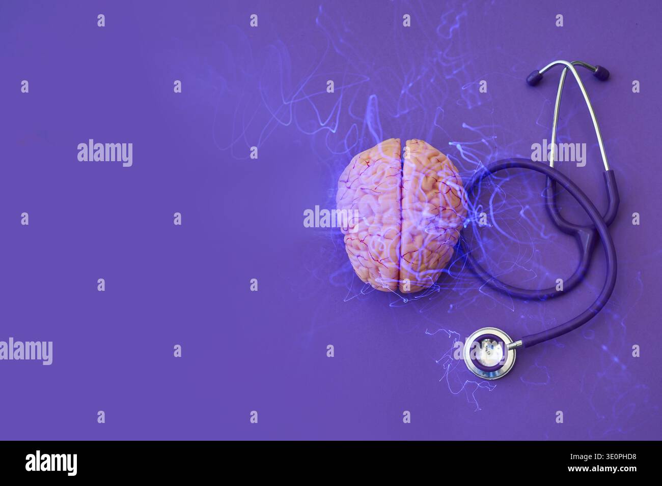Brain model having glowing neural activity lines, next to a stethoscope Stock Photo