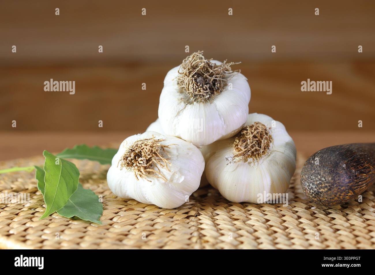 garlic bulbs (heads) on kitchen bench. Stock Photo