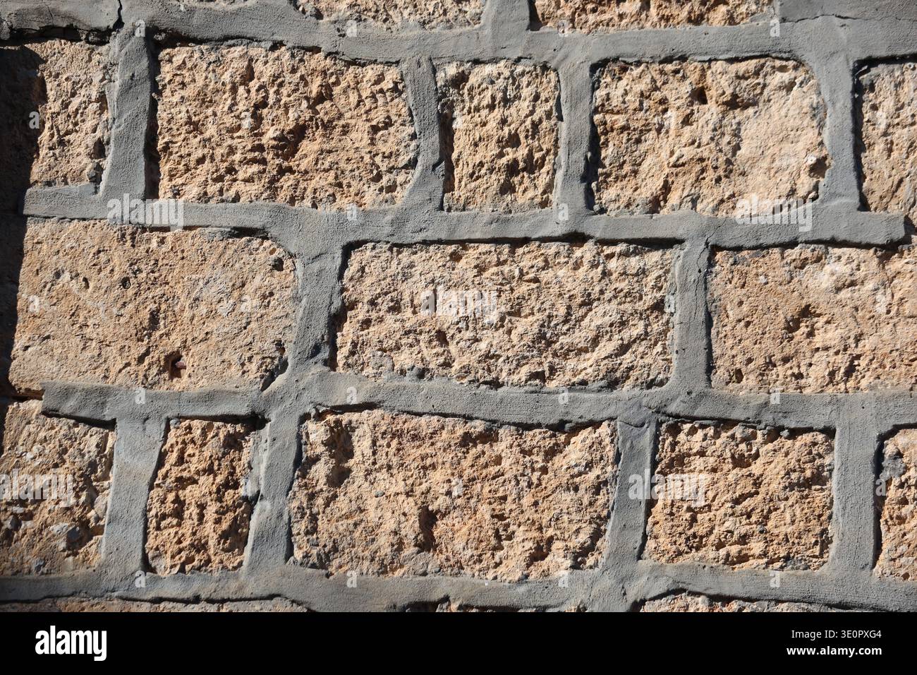 old stone wall with rough surface Stock Photo