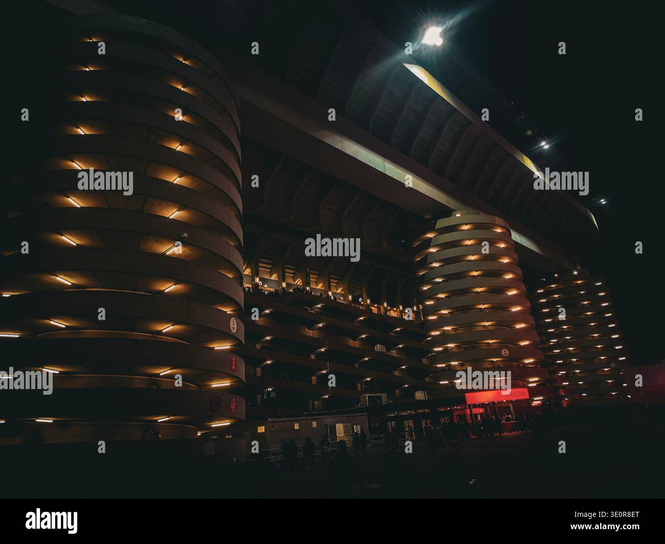 San Siro Stadium exterior at night, Milan, Italy – March 8, 2026: Illuminated facade of the stadium during the Derby della Madonnina Stock Photo