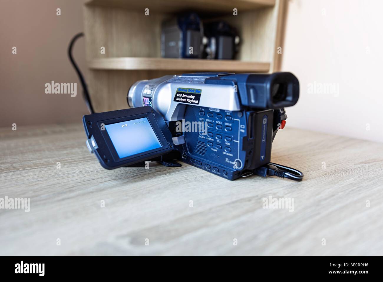 Vintage Digital8 Camcorder with Open LCD Screen on Wooden Table Stock Photo