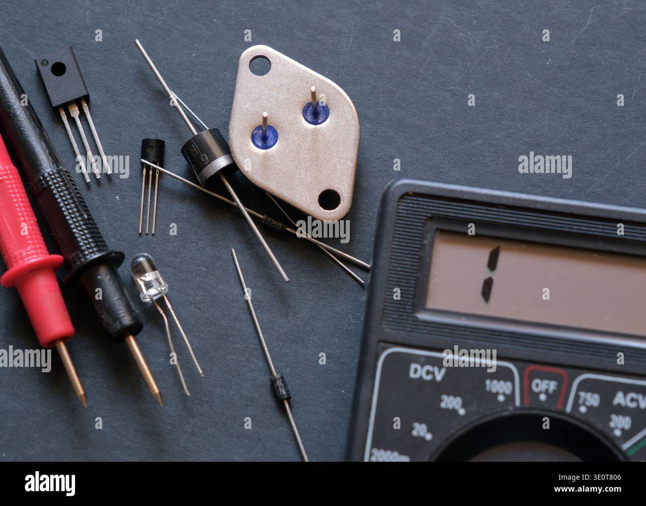 Electronic components on the table. Semiconductor diodes and transistors. Stock Photo