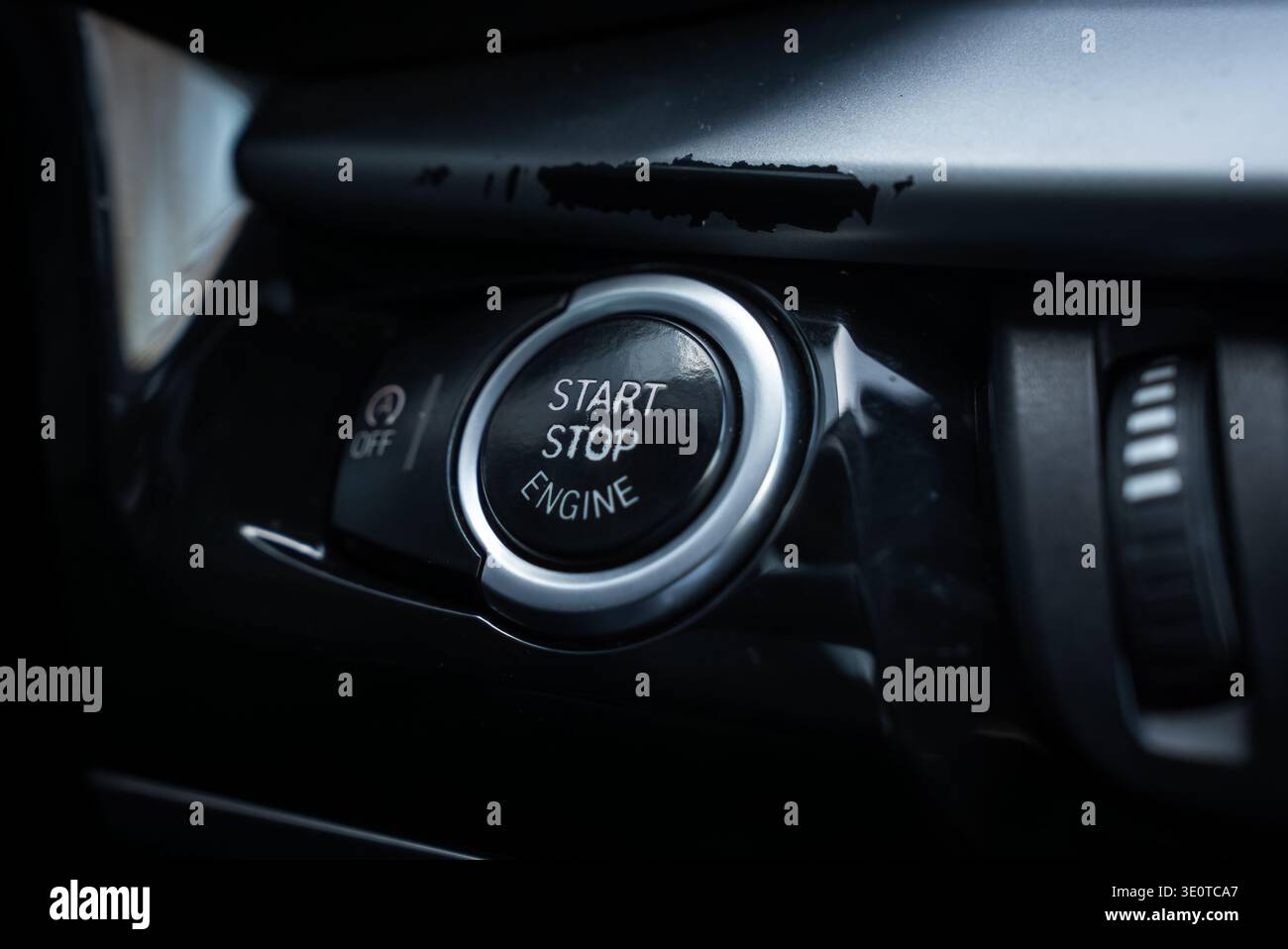 BMW X5 start stop engine button on glossy black center console Stock Photo