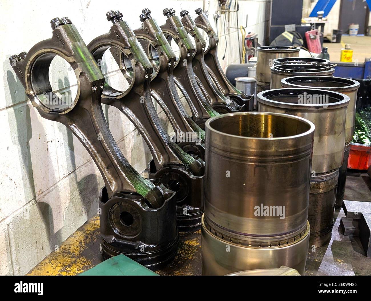 Transport Truck Engine Rehaul Repair Pistons On A Mechanics Workbench - Smartphone Captured Stock Image