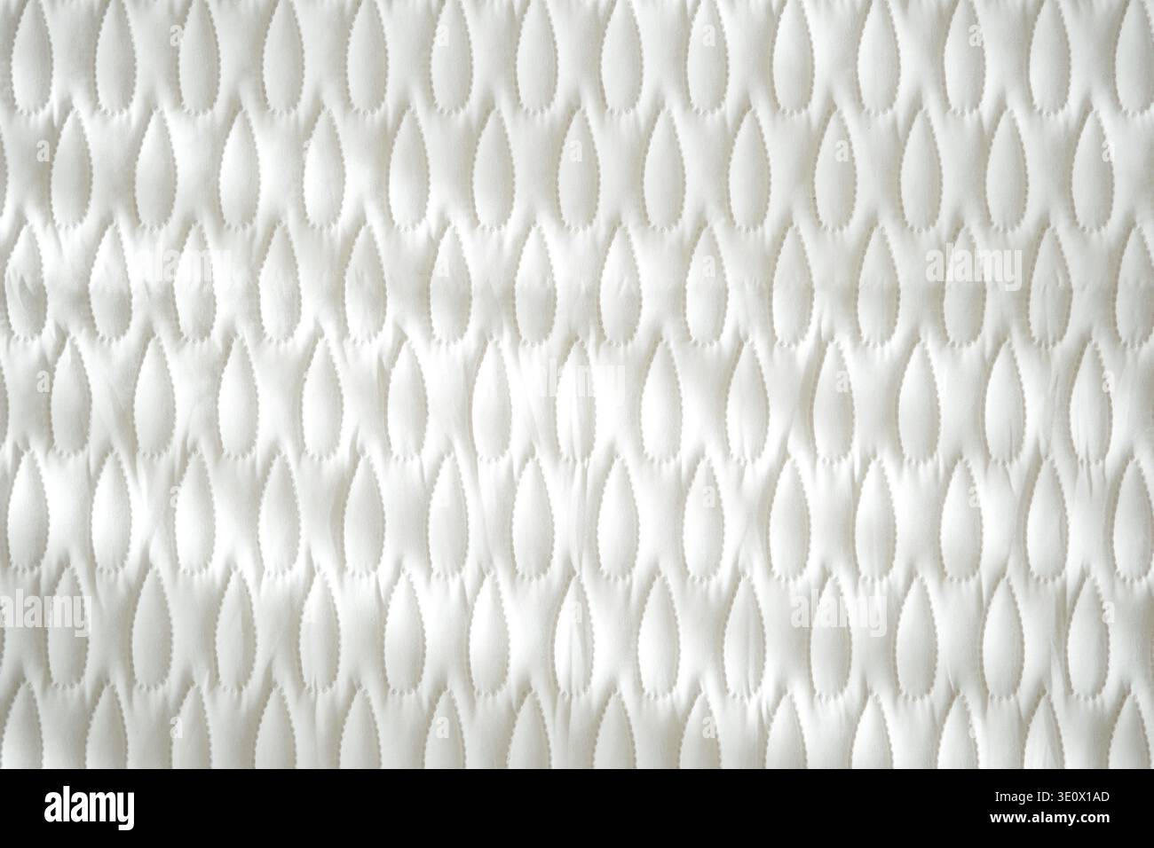 Textured fabric pattern in white color on a flat surface Stock Photo
