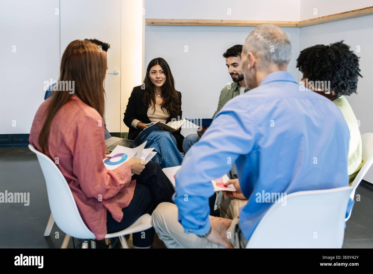 Diverse business team collaborating during meeting in office Stock Photo