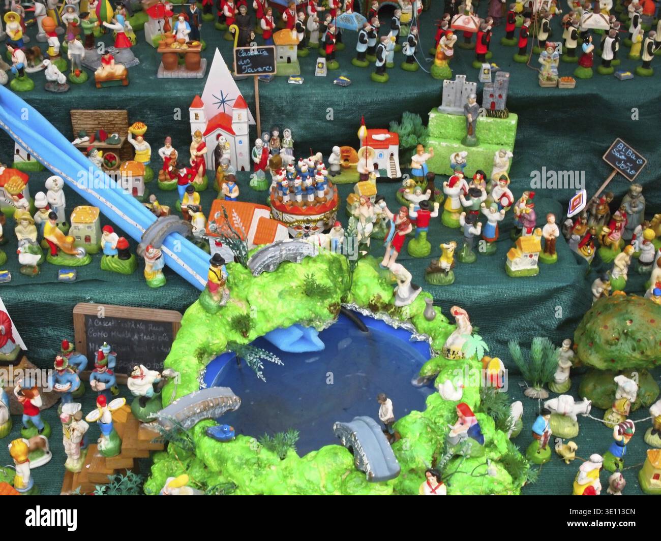 Miniature village showcasing daily life with figurines representing ...