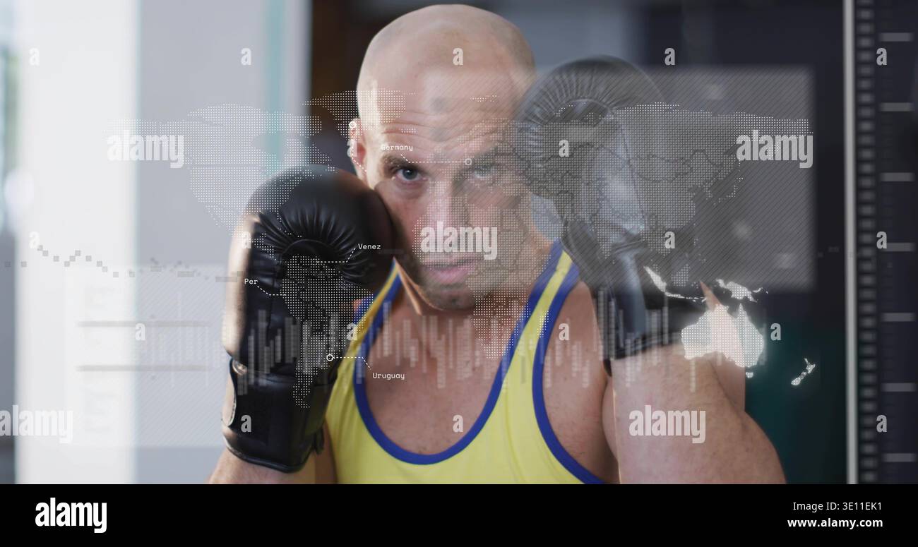 Holding guard bald boxer wearing yellow singlet and black gloves at gym, with world map overlay Stock Photo