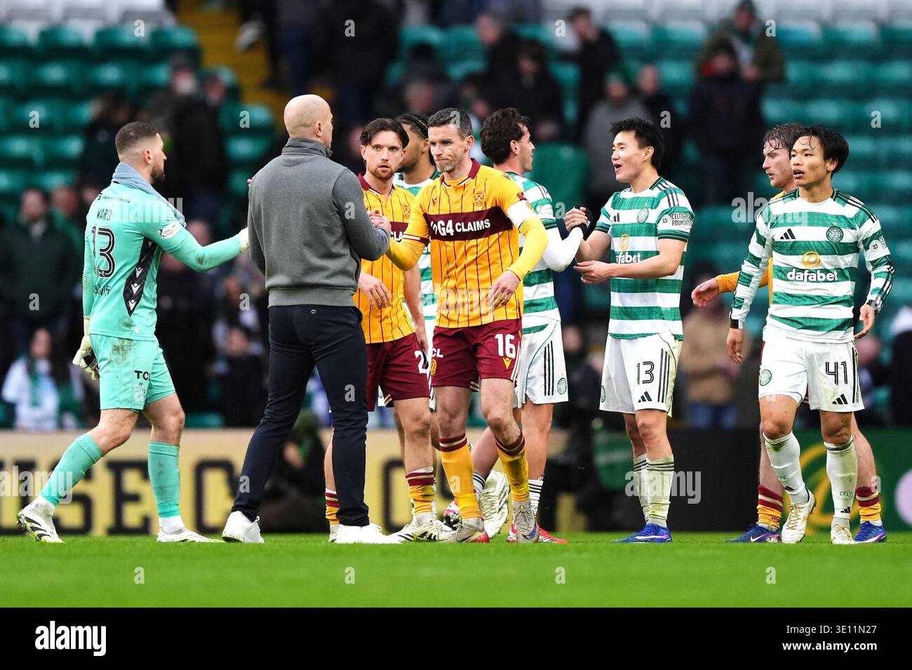 Celtic And Motherwell Players Shake Hands After The Final Whistle In celtic-and-motherwell-players-shake-hands-after-the-final-whistle-in