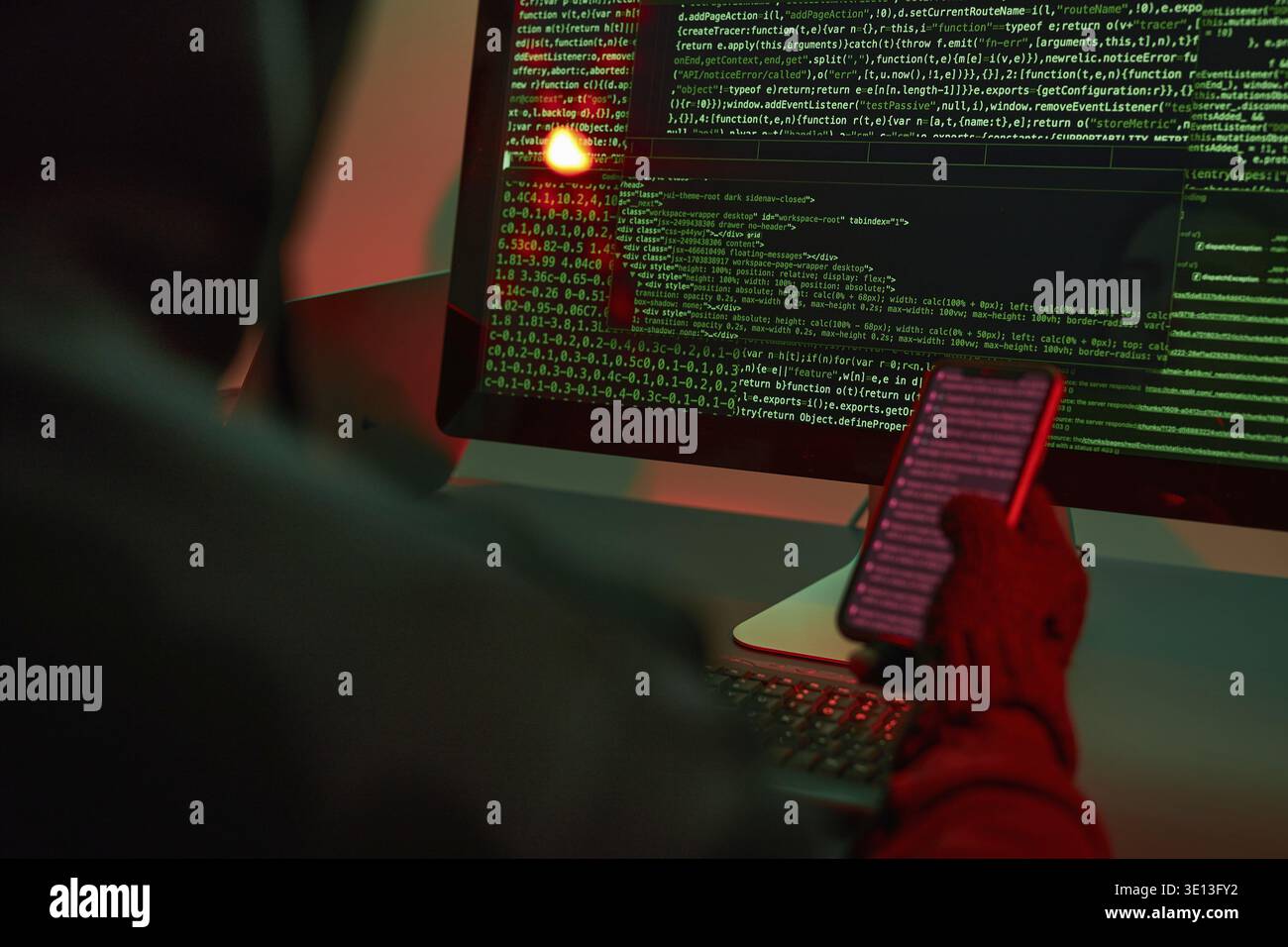 Anonymous people using computer and programming to break code. Cyber security threat. Internet and network security. Access to private information. An Stock Photo