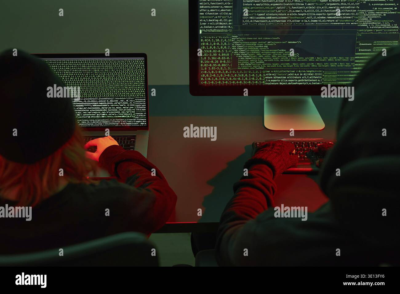 Anonymous people using computer and programming to break code. Cyber security threat. Internet and network security. Access to private information. An Stock Photo