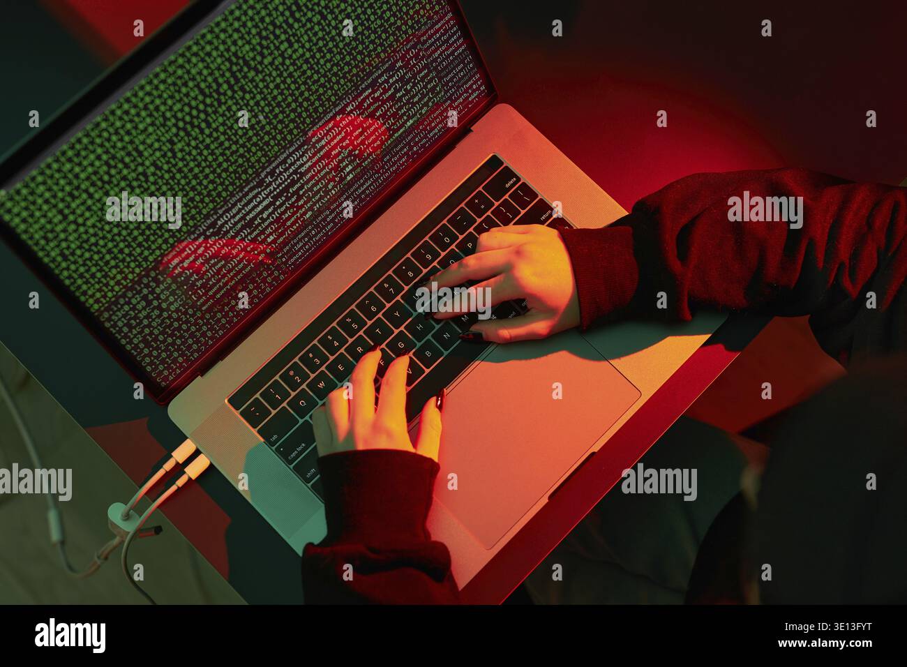 Anonymous people using computer and programming to break code. Cyber security threat. Internet and network security. Access to private information. An Stock Photo