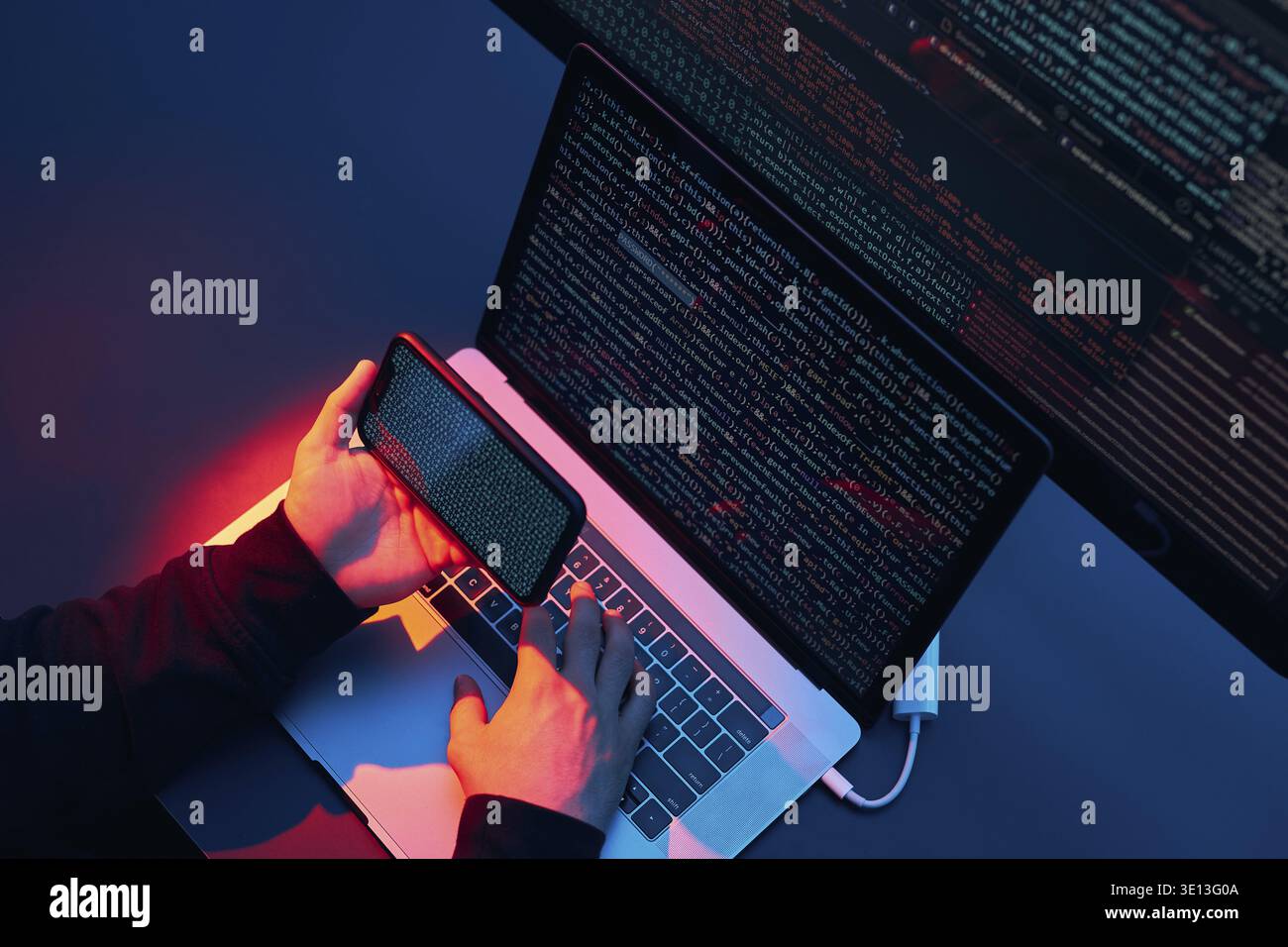 Man using computer and programming to break code. Cyber security threat. Internet and network security. Stealing private information. Person using tec Stock Photo
