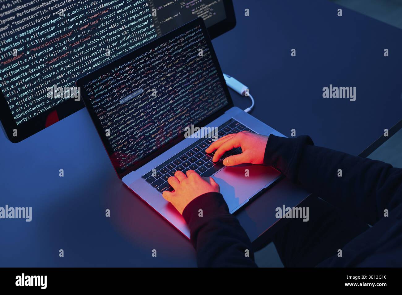 Man using computer and programming to break code. Cyber security threat. Internet and network security. Stealing private information. Person using tec Stock Photo