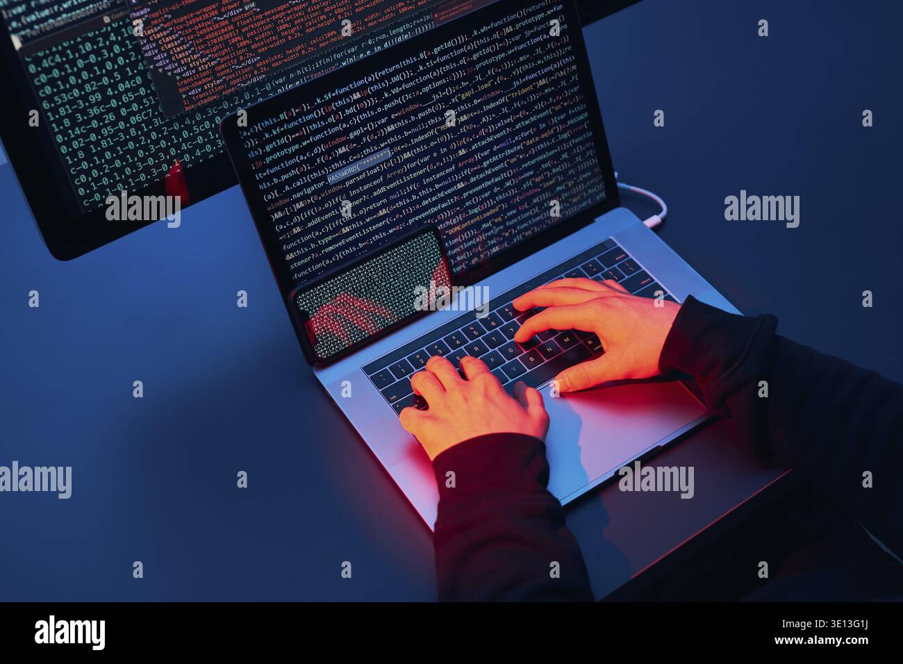 Man using computer and programming to break code. Cyber security threat. Internet and network security. Stealing private information. Person using tec Stock Photo