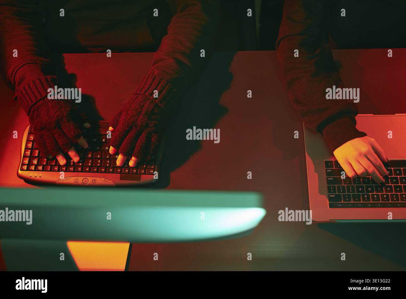 Anonymous people using computer and programming to break code. Cyber security threat. Internet and network security. Access to private information. An Stock Photo