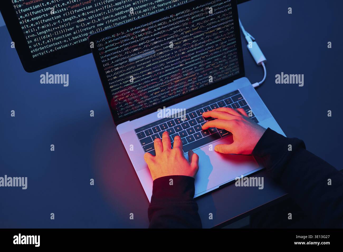 Man using computer and programming to break code. Cyber security threat. Internet and network security. Stealing private information. Person using tec Stock Photo