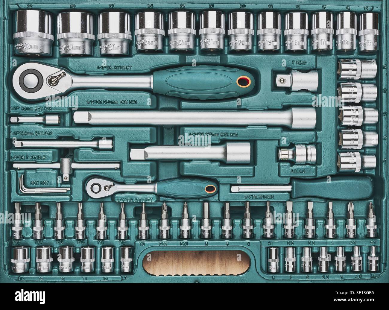Ratchet with many attachments in plastic case. Work tools. Universal tool set. Background Stock Photo