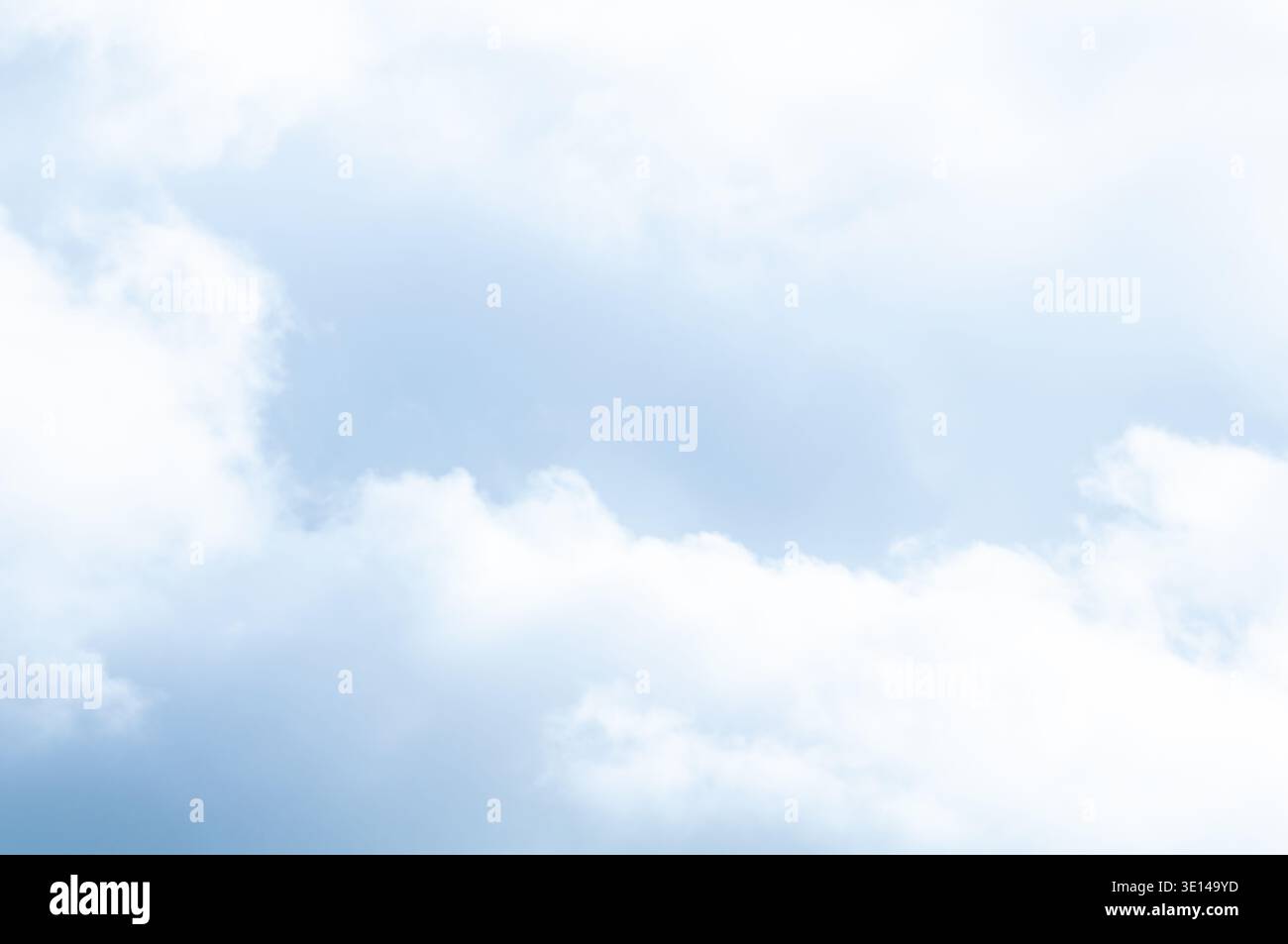 Soft cloudy sky with light overcast clouds and subtle blue tones Stock Photo