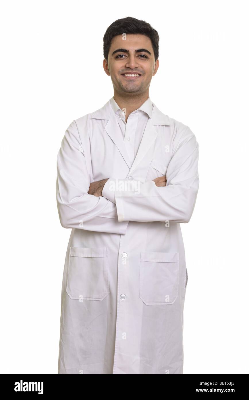Young happy Persian man doctor isolated against white background Stock Photo