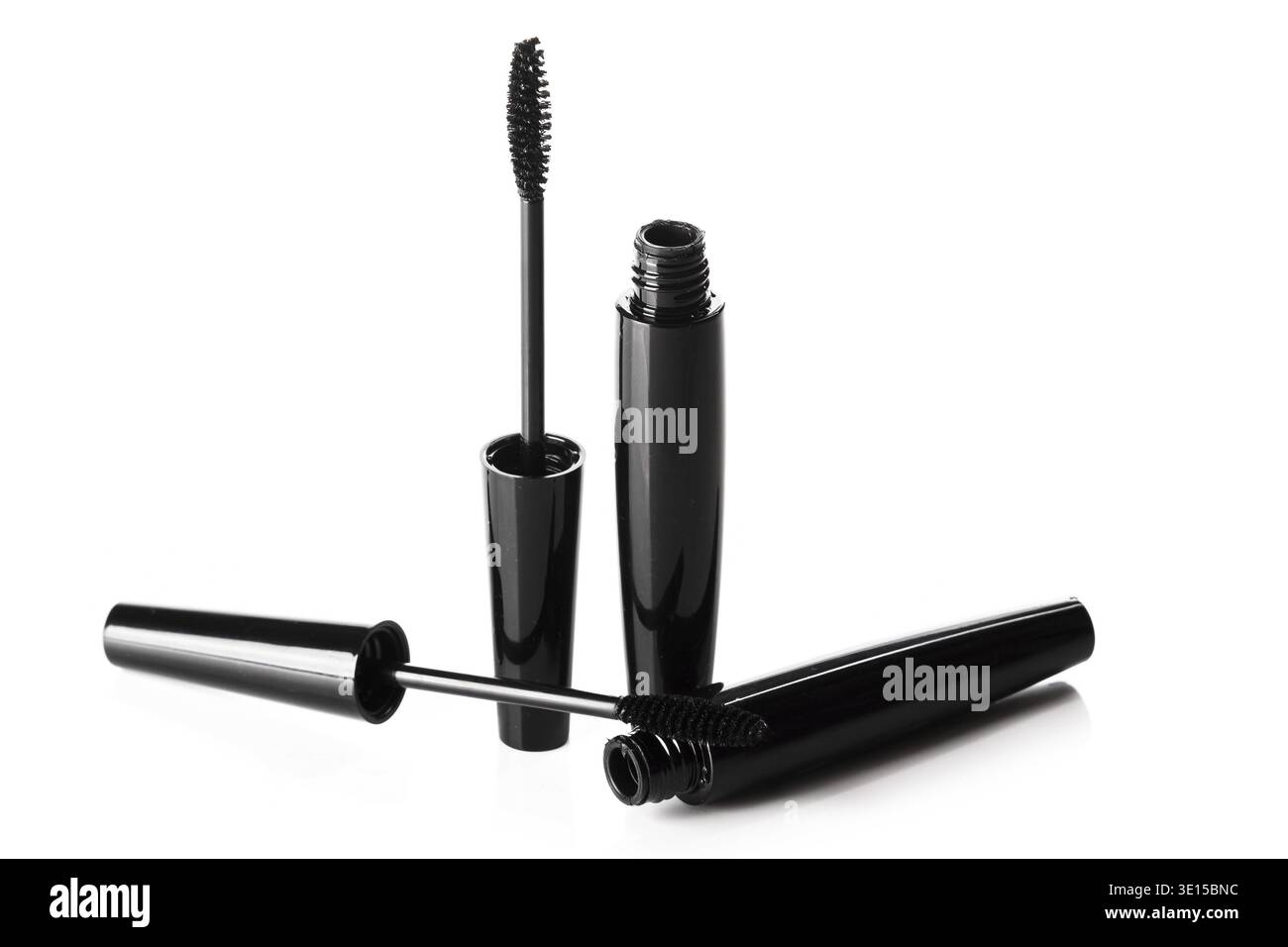 Mascara brushes and containers on white background Stock Photo