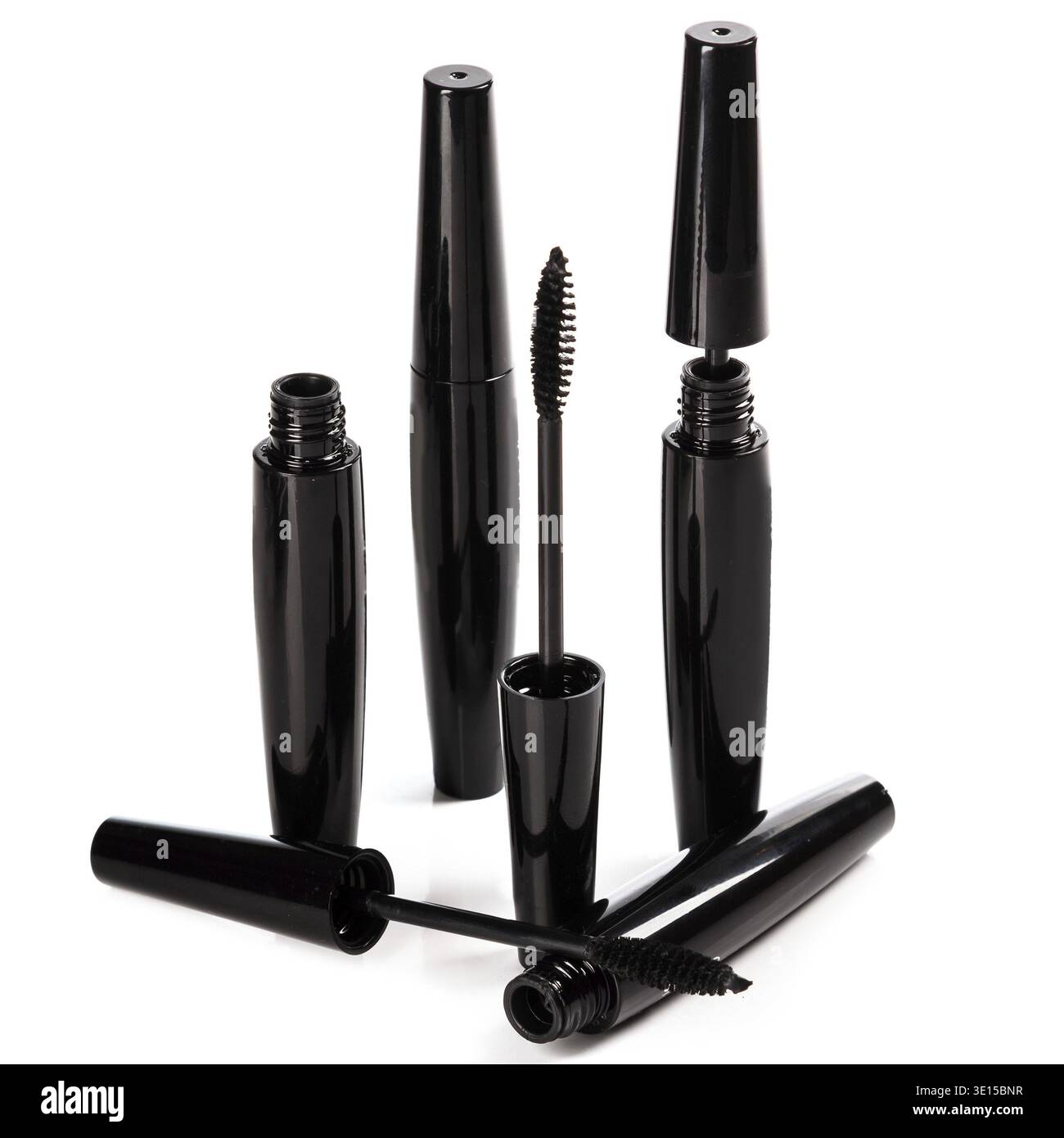 Mascara brushes and containers on white background Stock Photo