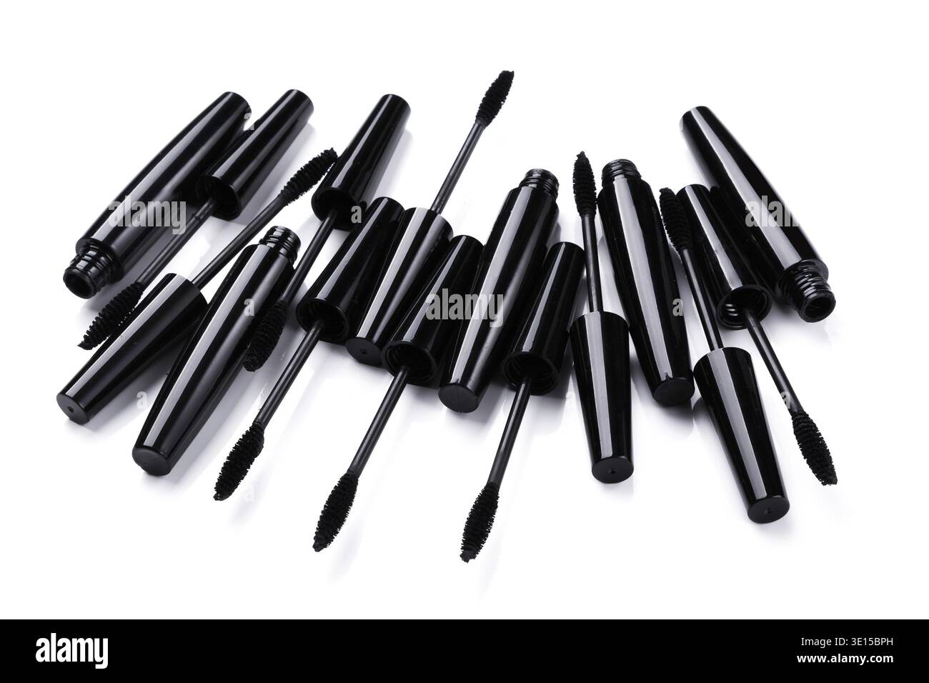Mascara brushes and containers on white background Stock Photo