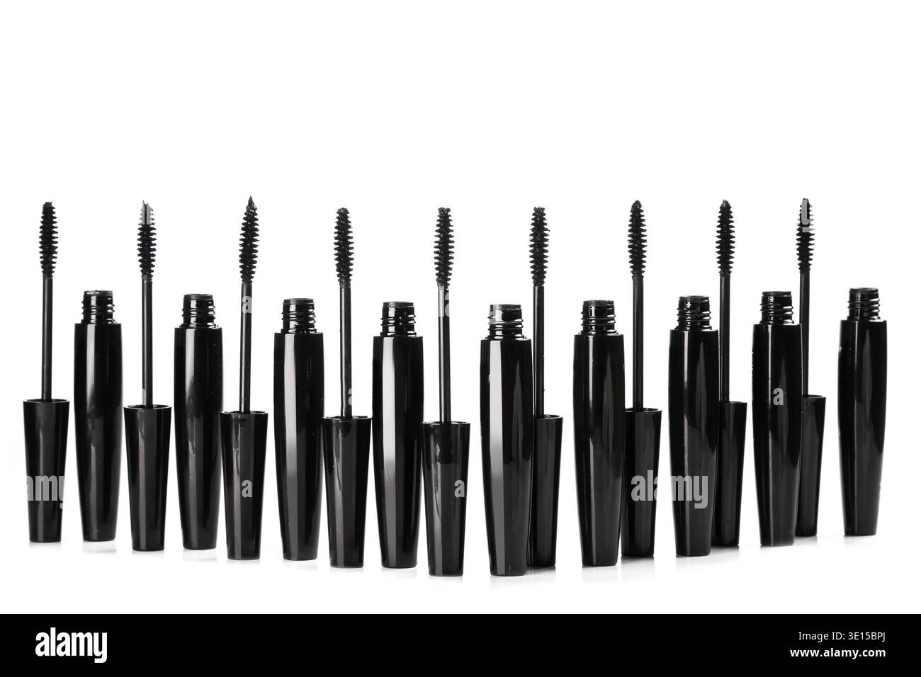 Mascara brushes and containers on white background Stock Photo