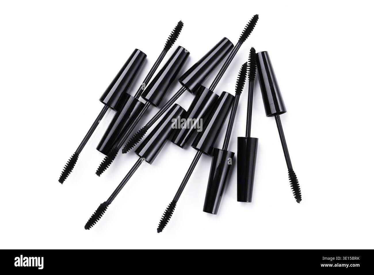 Mascara brushes and containers on white background Stock Photo