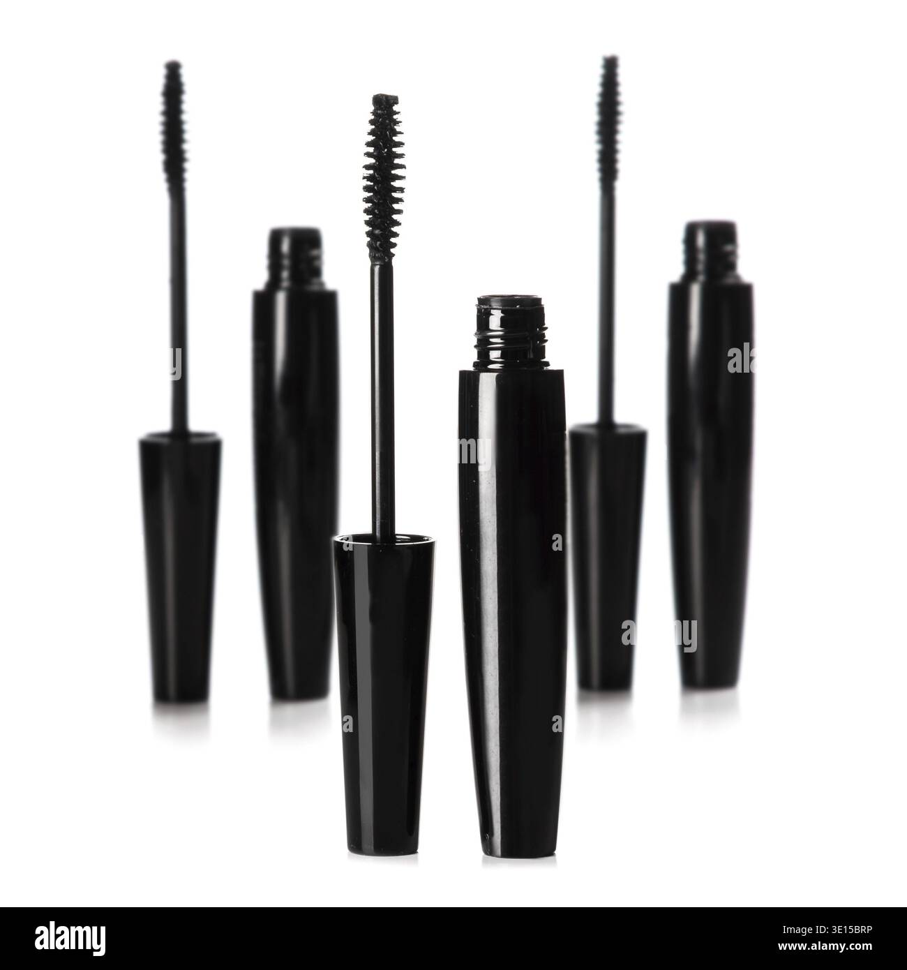 Mascara brushes and containers on white background Stock Photo