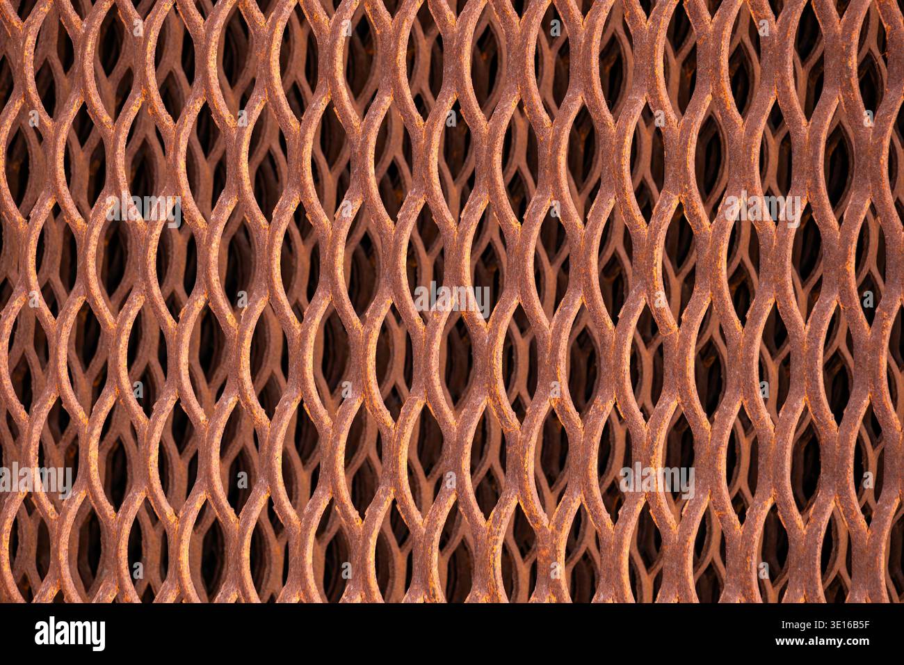Rusting expanded metal reinforcing old industrial flooring grid pattern texture Stock Photo