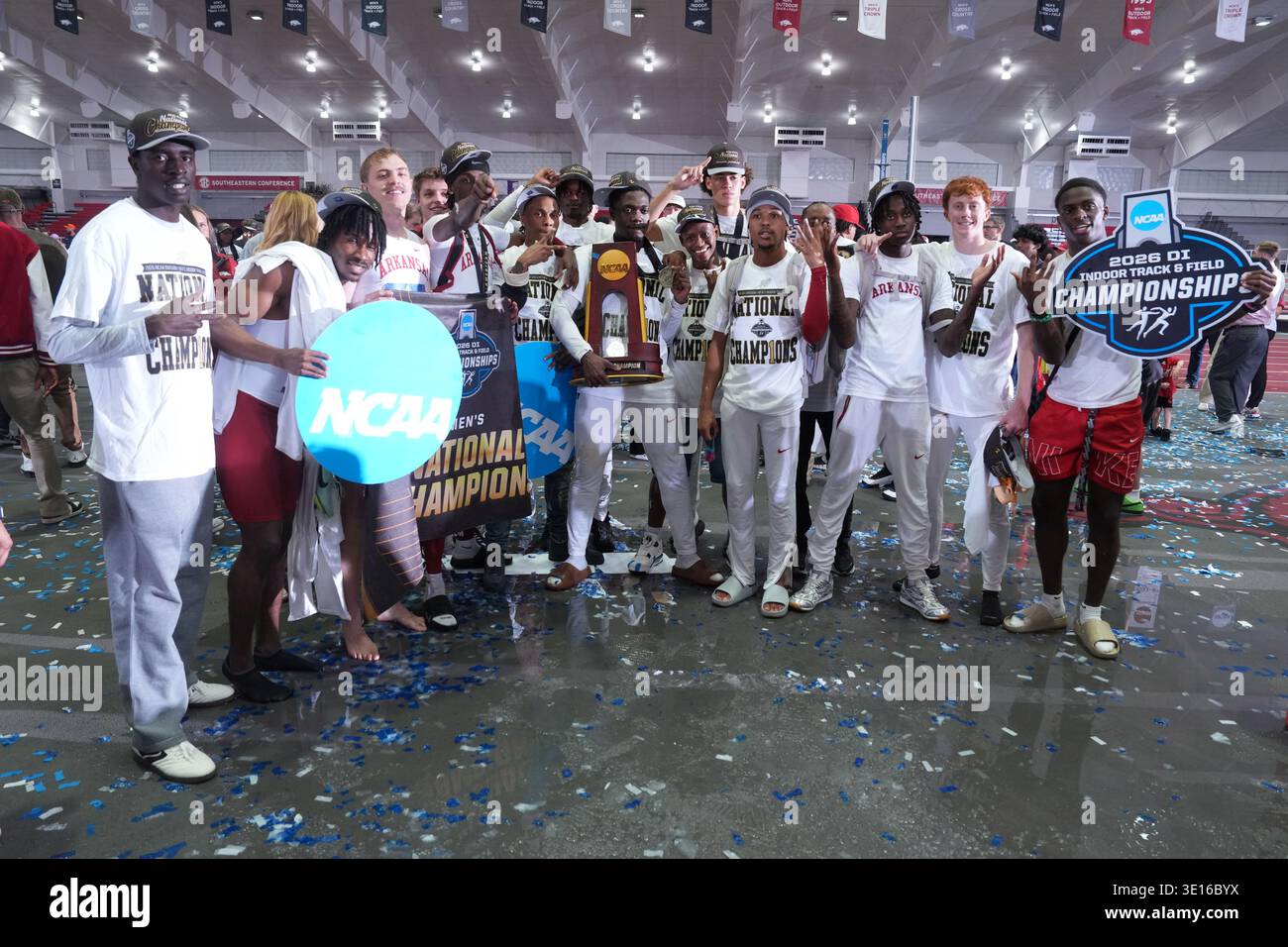 Members of Arkansas Razorbacks team celebrate after winning the men's ...