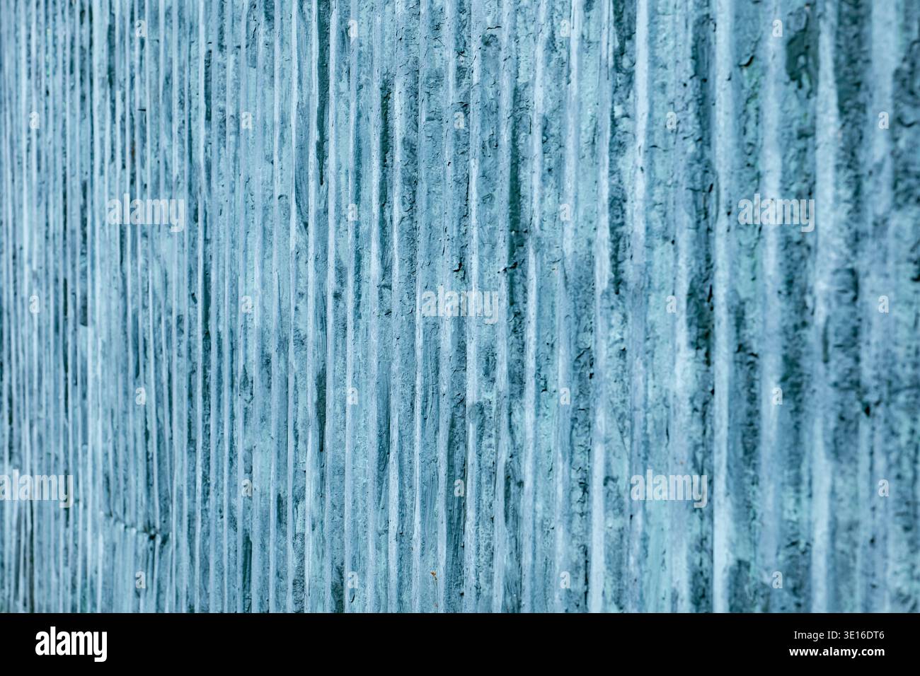 Weathered blue wall texture providing a pattern and background with vertical stripes Stock Photo