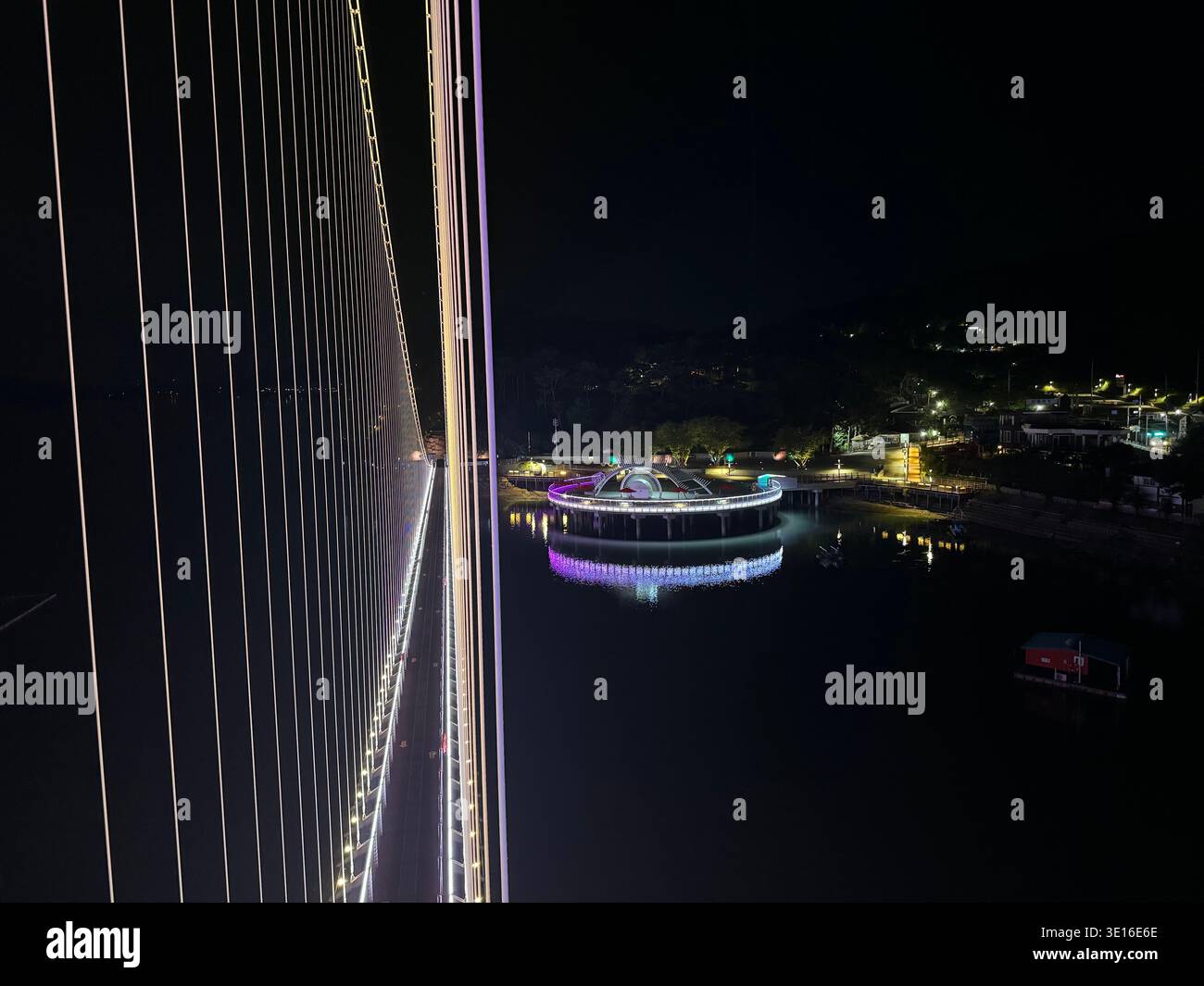 LED-Lit Suspension Bridge Cables and Glowing Round Pavilion over Water at Night, Modern Urban Nightscape, Yedang Reservoir, South Korea - Smartphone Captured Stock Image