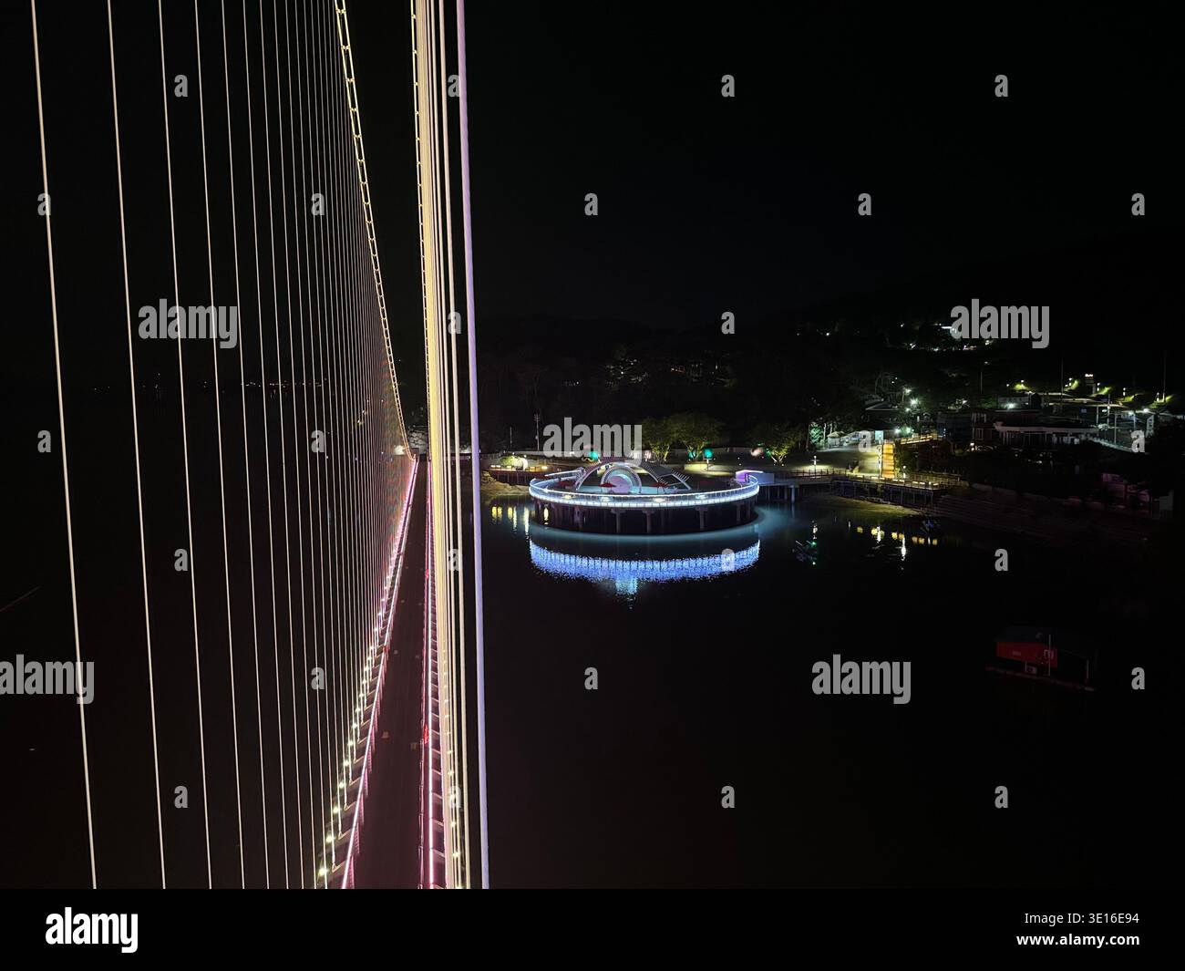 Night Cable-Stayed Bridge with Illuminated Circular Platform. Yedang Reservoir, Eungbong-myeon, Yesan-gun, Chungcheongnam-do, South Korea - Smartphone Captured Stock Image