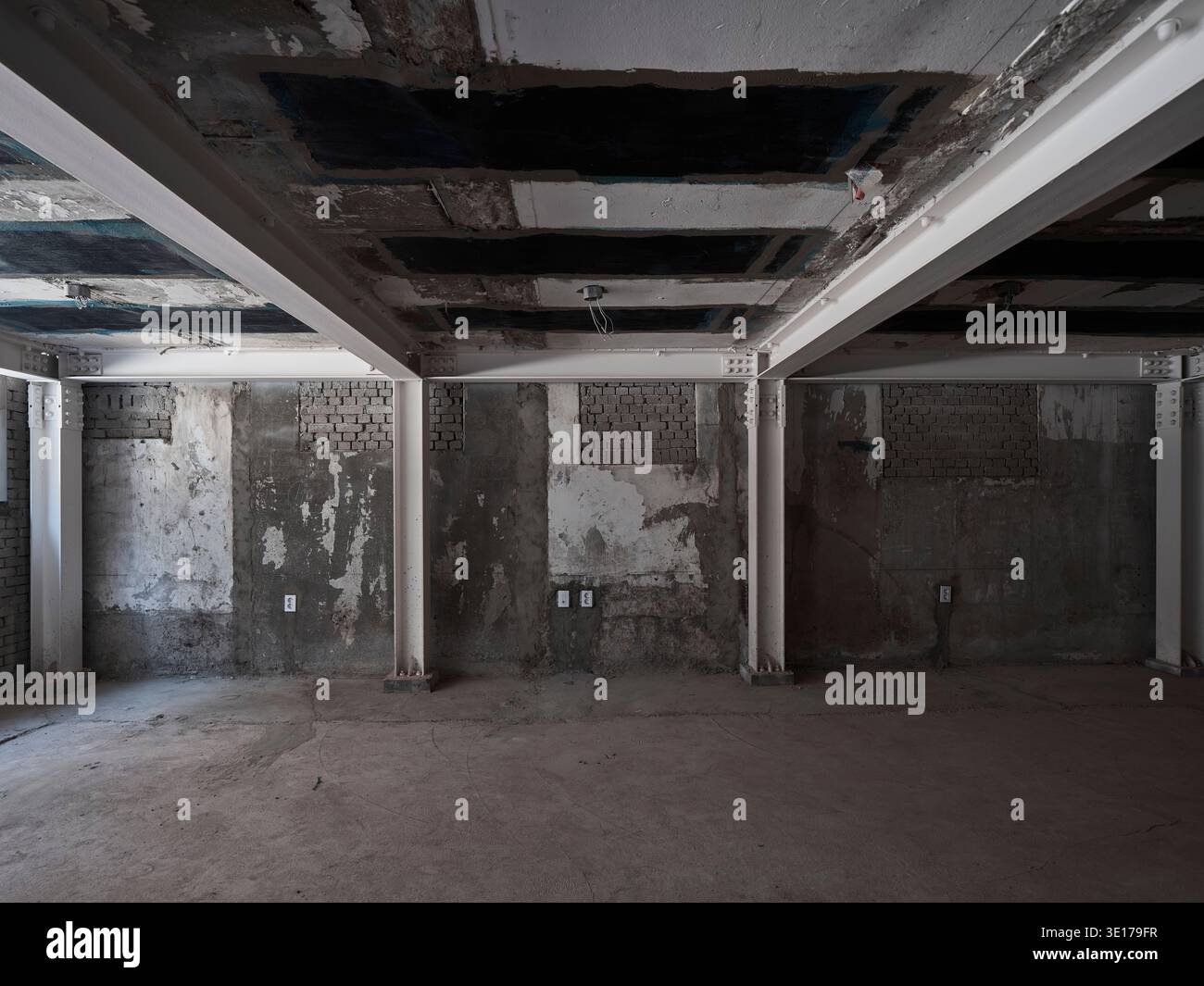 Raw unfinished concrete interior under construction. Stock Photo