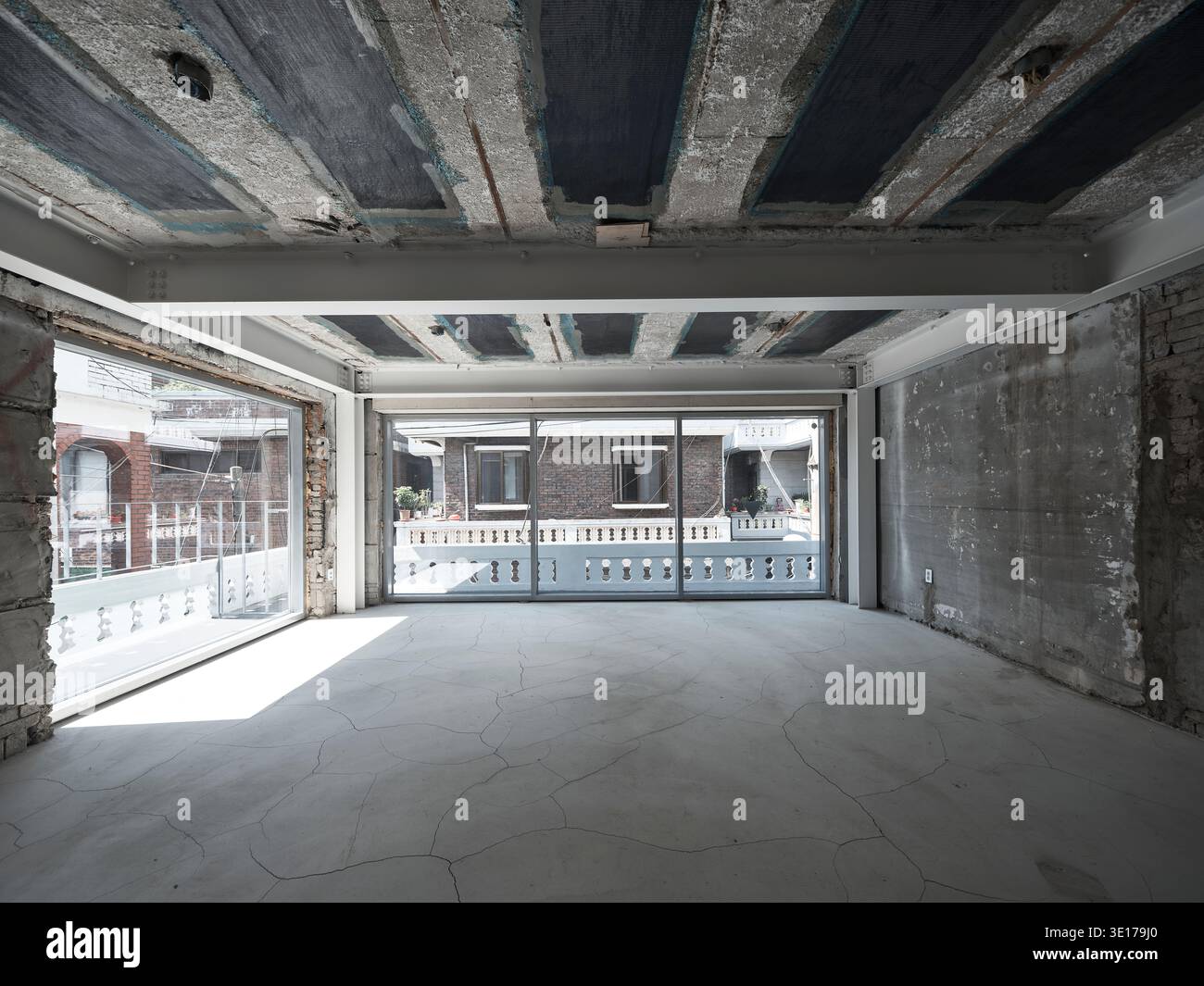 Raw unfinished concrete interior under construction. Stock Photo