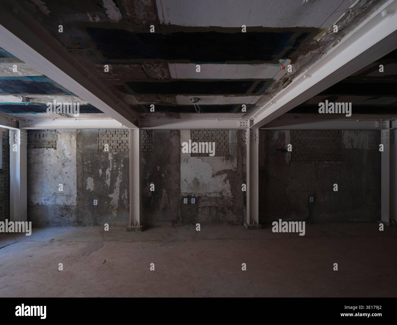 Raw unfinished concrete interior under construction. Stock Photo