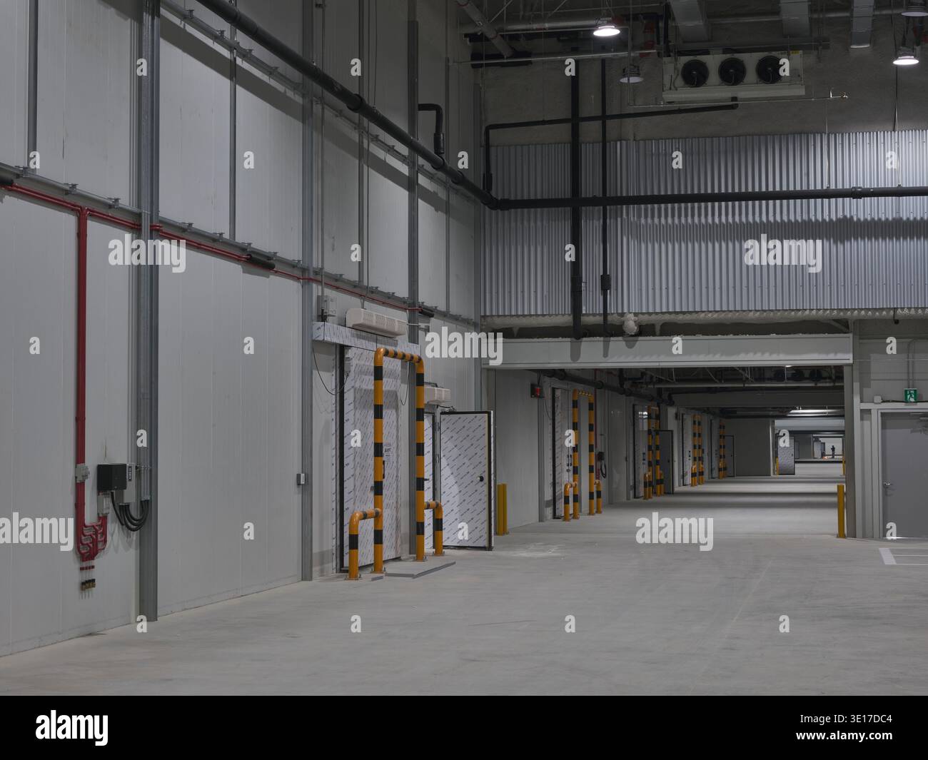Warehouse service corridor with loading docks. Stock Photo