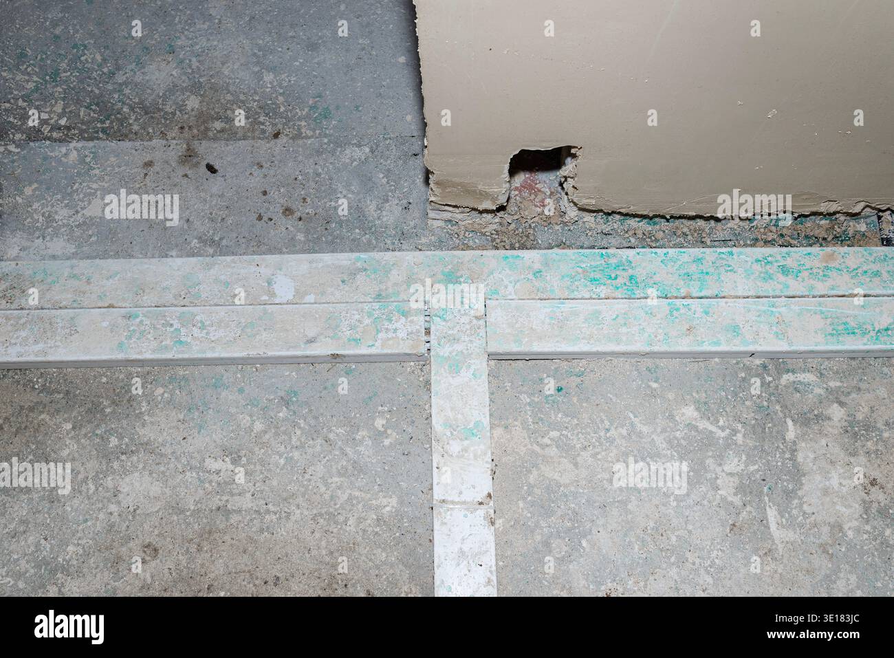Electrical conduits embedded in concrete floor during house construction Stock Photo