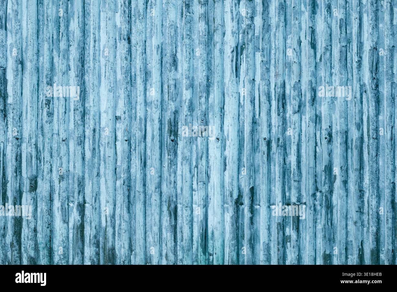 Weathered blue corrugated metal texture with vertical lines and industrial pattern Stock Photo