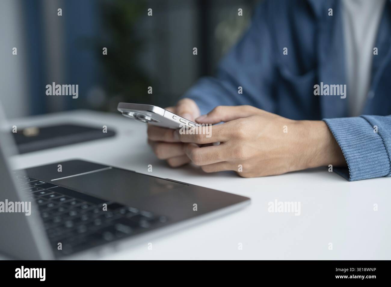 Man Using Smartphone in Modern Office Technology Stock Photo